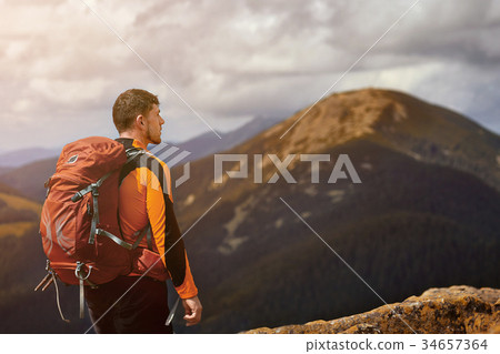 Male traveler from back in the mountains 34657364