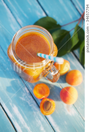 Glass of fresh apricot smoothie Glass of fresh apricot smoothie 34657794