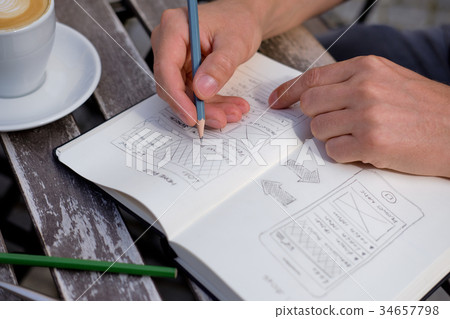 Man draws a sketch graphic design 34657798