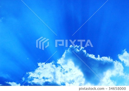 Blue sky with white clouds with sun rays 34658000
