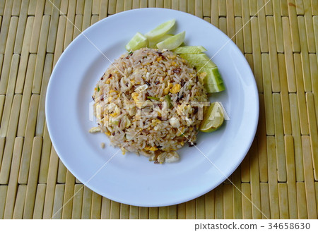 fried mixed white and brown rice with crab meat 34658630
