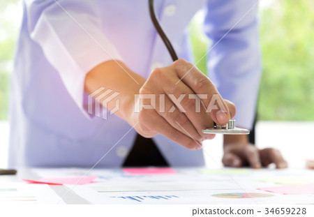 Businessmen in a laboratory set hold medical. Businessmen in a laboratory set hold medical. 34659228