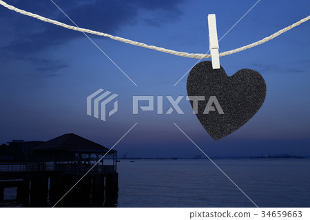 Black Heart hung on hemp rope. Black Heart hung on hemp rope. 34659663