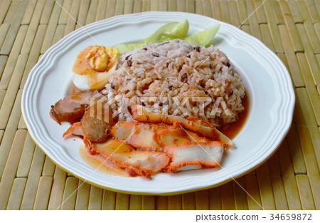 barbecued red pork dressing sweet sauce on rice 34659872