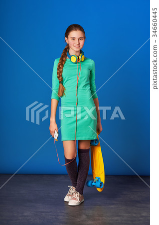 Sporty pretty teen girl loves sports. 34660445
