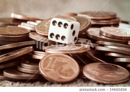 Dice and coin pile 34660806