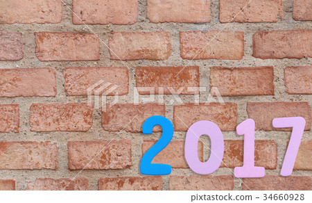 Number of 2017 on a brick wall background. Number of 2017 on a brick wall background. 34660928