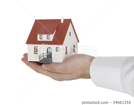 Home sitting on a hand with clipping path Home sitting on a hand with clipping path 34661358