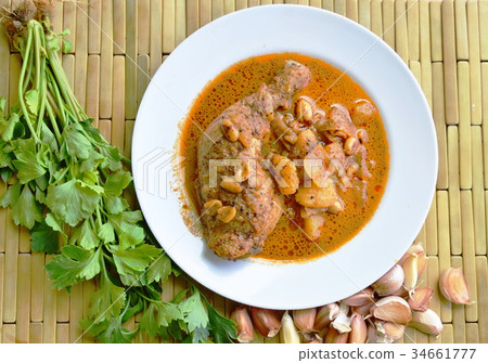 chicken leg spicy and sweet curry on dish chicken leg spicy and sweet curry on dish 34661777