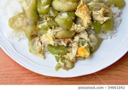 stir fried gourd with egg on rice stir fried gourd with egg on rice 34661842