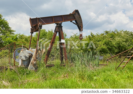 Oil well on a landscape 34663322