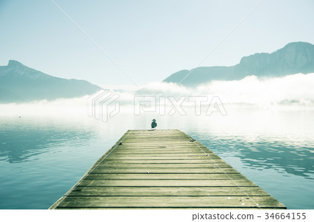 Pier by mountain lake Mondsee in Austria 34664155