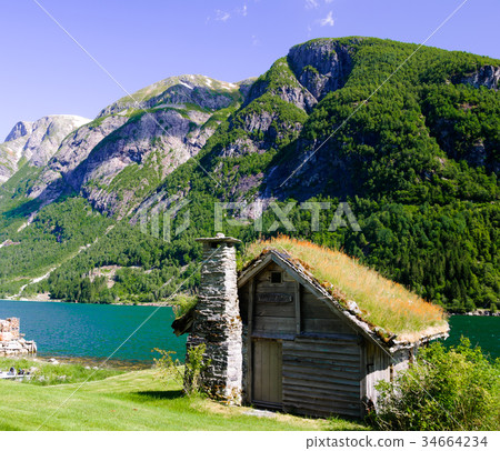 Traditional stone building by Sognefjord in Norway 34664234