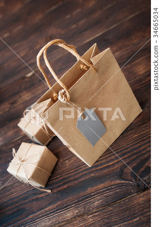 Mockup Paper bag from kraft paper with gift tag 34665034