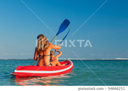 Family summer beach activity. Paddling on kayak. 34666251