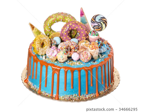 A festive cake made from sweet ornaments on day of 34666295