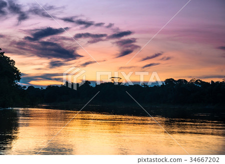 Sunset over Amazon river in Brazil Sunset over Amazon river in Brazil 34667202