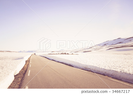 Street in the mountain landscape of norway 34667217