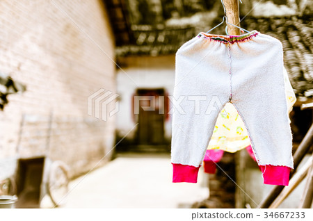 laundry of children on clothesline in China laundry of children on clothesline in China 34667233