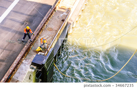dock workers vessel ship at the harbor dock workers vessel ship at the harbor 34667235