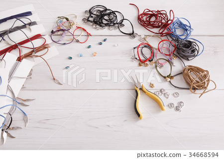 Handmade bracelets making, artisan workplace 34668594