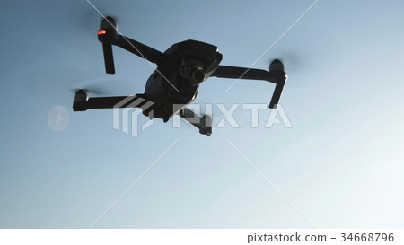 Flying drone in nature Flying drone in nature 34668796