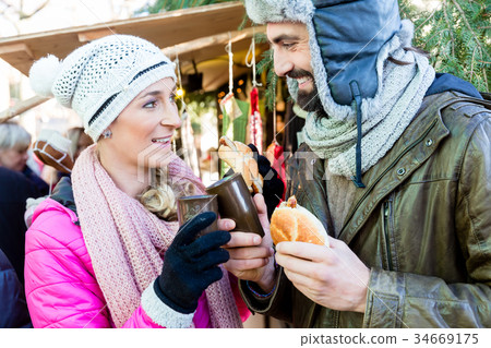 Woman and man eating and drinking on Christmas 34669175