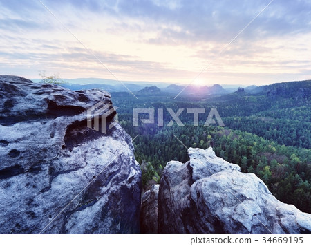Spring morning nature. The cracked sandstone cliff 34669195