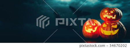 Three halloween Jack O' Lantern pumpkins Three halloween Jack O' Lantern pumpkins 34670202