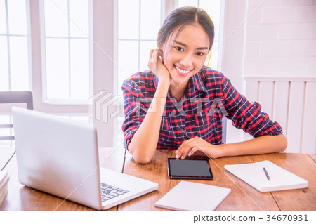 Businesswoman working at modern office. 34670931