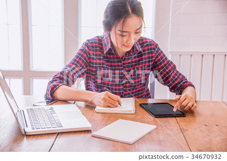 Businesswoman working at modern office. 34670932