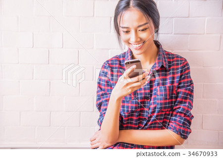 Using smart phone. 34670933