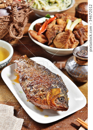 Braised crucian carp with scallion Braised crucian carp with scallion 34672012
