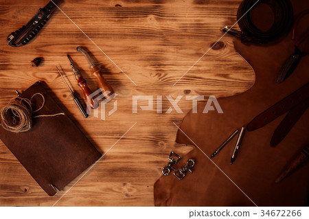 Leather craft. Tanner's tools on grey wooden 34672266