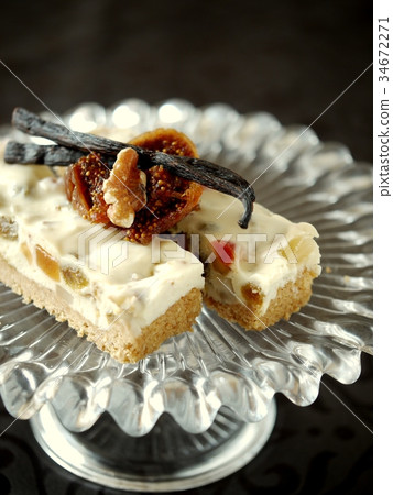 Dried fruit rare cheese cake black background (vertical position) Dried fruit rare cheese cake black background (vertical position) 34672271