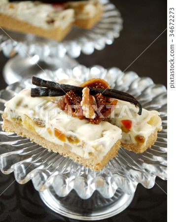 Dried fruit rare cheese cake black background (vertical position) Dried fruit rare cheese cake black background (vertical position) 34672273