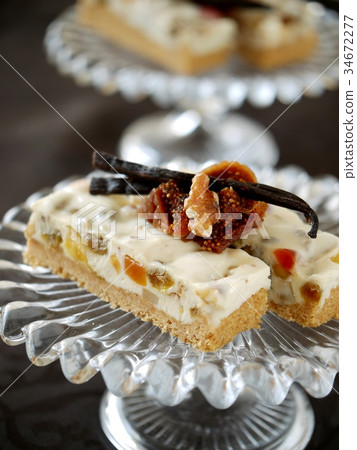 Dried fruit rare cheese cake black background (vertical position up) 34672277