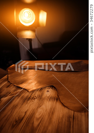 Leather craft on wooden background. Tanner's Leather craft on wooden background. Tanner's 34672279