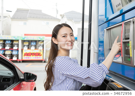 Gas station refueling self person drive car rental 34672956