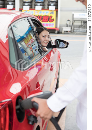 Gas station refueling self person drive car rental 34672980