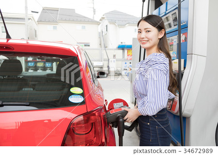 Gas station refueling self person drive car rental Gas station refueling self person drive car rental 34672989