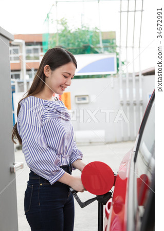 Gas station refueling self person drive car rental 34672991