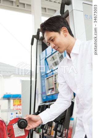 Gas station refueling self person drive car rental 34673003