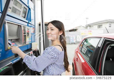 Gas station refueling self person drive car rental 34673229