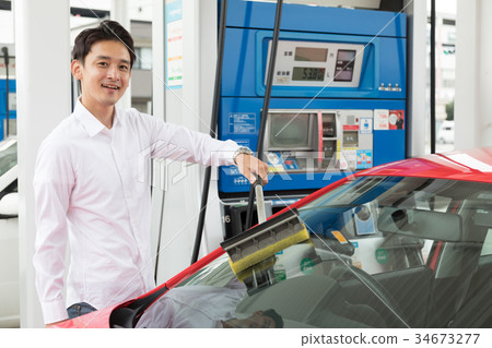 Gas station refueling self person drive car rental 34673277