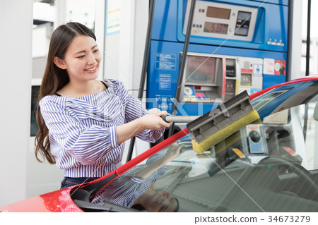 Gas station refueling self person drive car rental Gas station refueling self person drive car rental 34673279