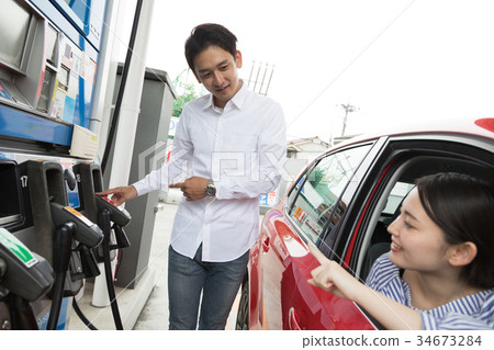 Gas station refueling self person drive car rental 34673284