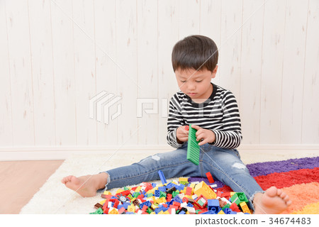 Boys playing in the room 34674483