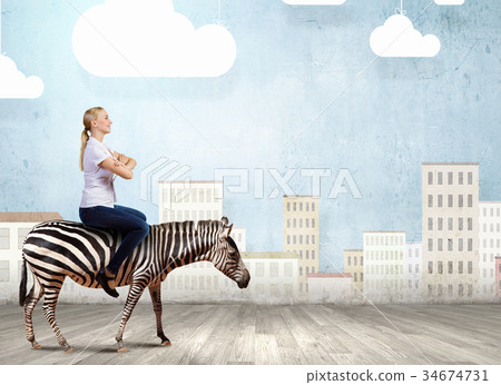 Woman ride zebra Woman ride zebra 34674731