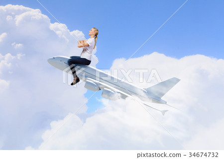 Woman ride airplane 34674732